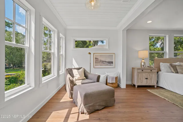 a bedroom with furniture and a window