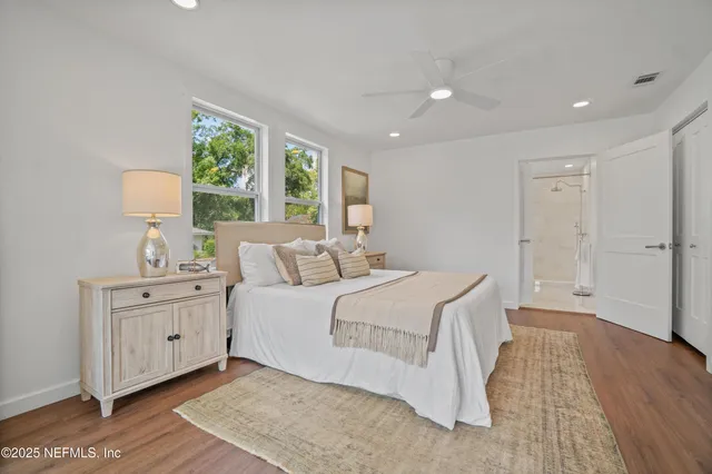 a bed room with a bed and a window