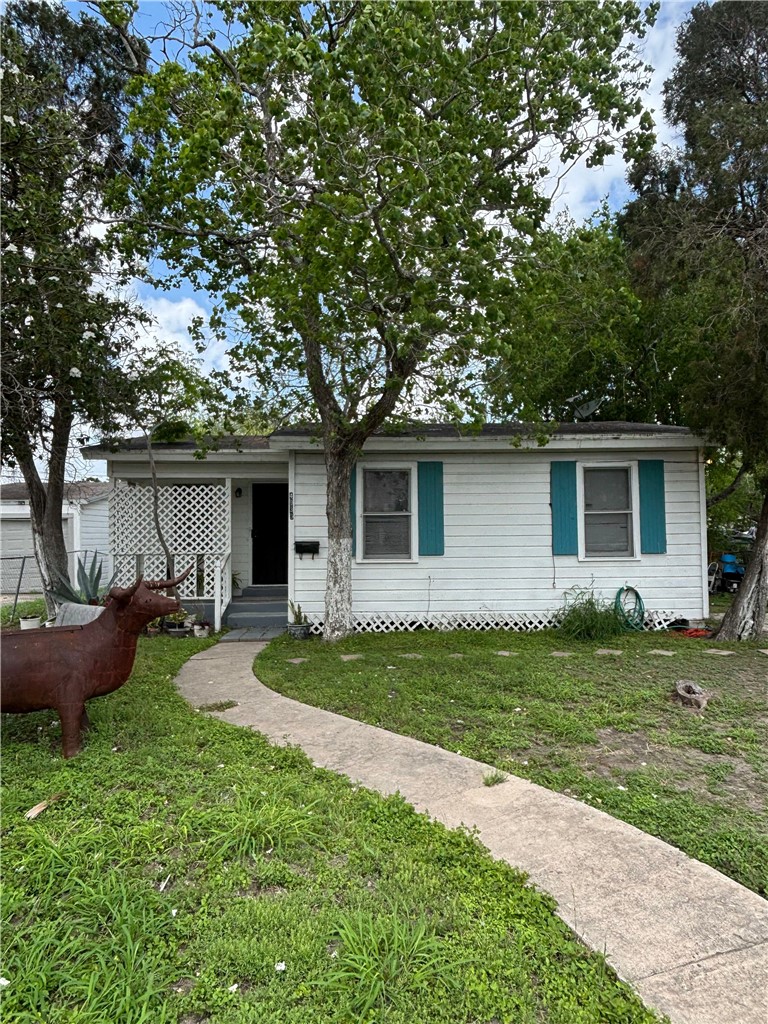 4933 Concord Street Corpus Christi, TX 78415 - Photo 1 of 6 a front view of house with yard and green space