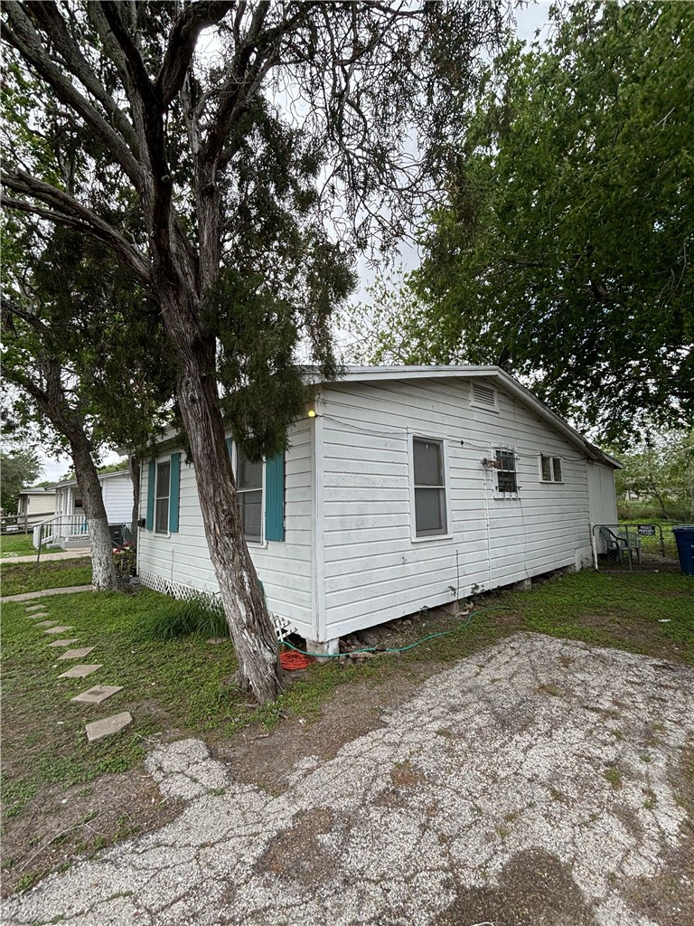 4933 Concord Street Corpus Christi, TX 78415 - Photo 3 of 6 a view of a house with a yard