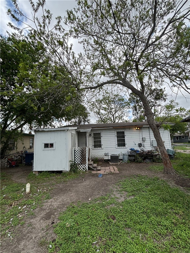 4933 Concord Street Corpus Christi, TX 78415 - Photo 4 of 6 a view of a house with a yard and trees