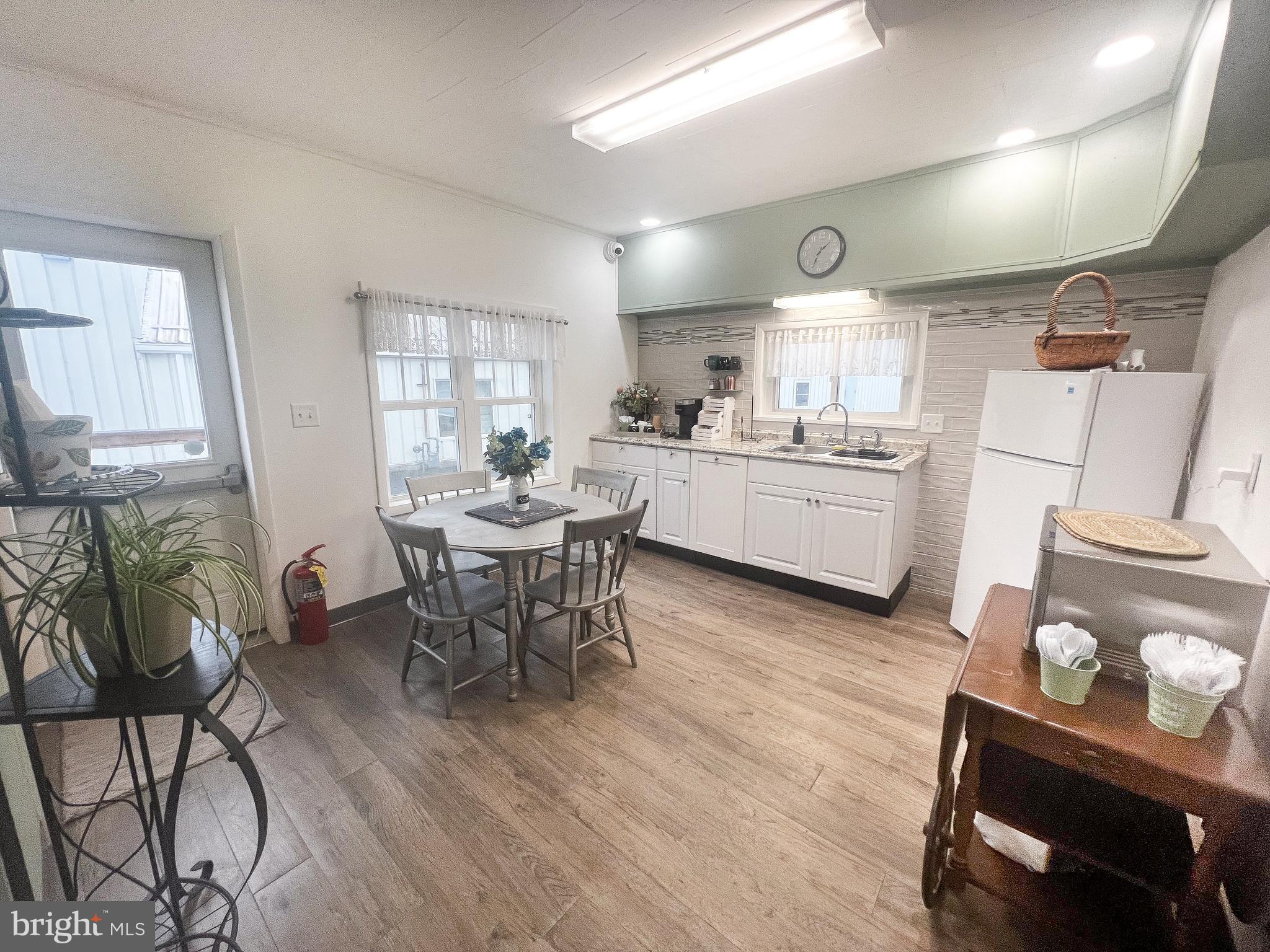 336 South Main Street Burnham, PA 17009 - Photo 13 of 36 a kitchen with a dining table chairs and stove