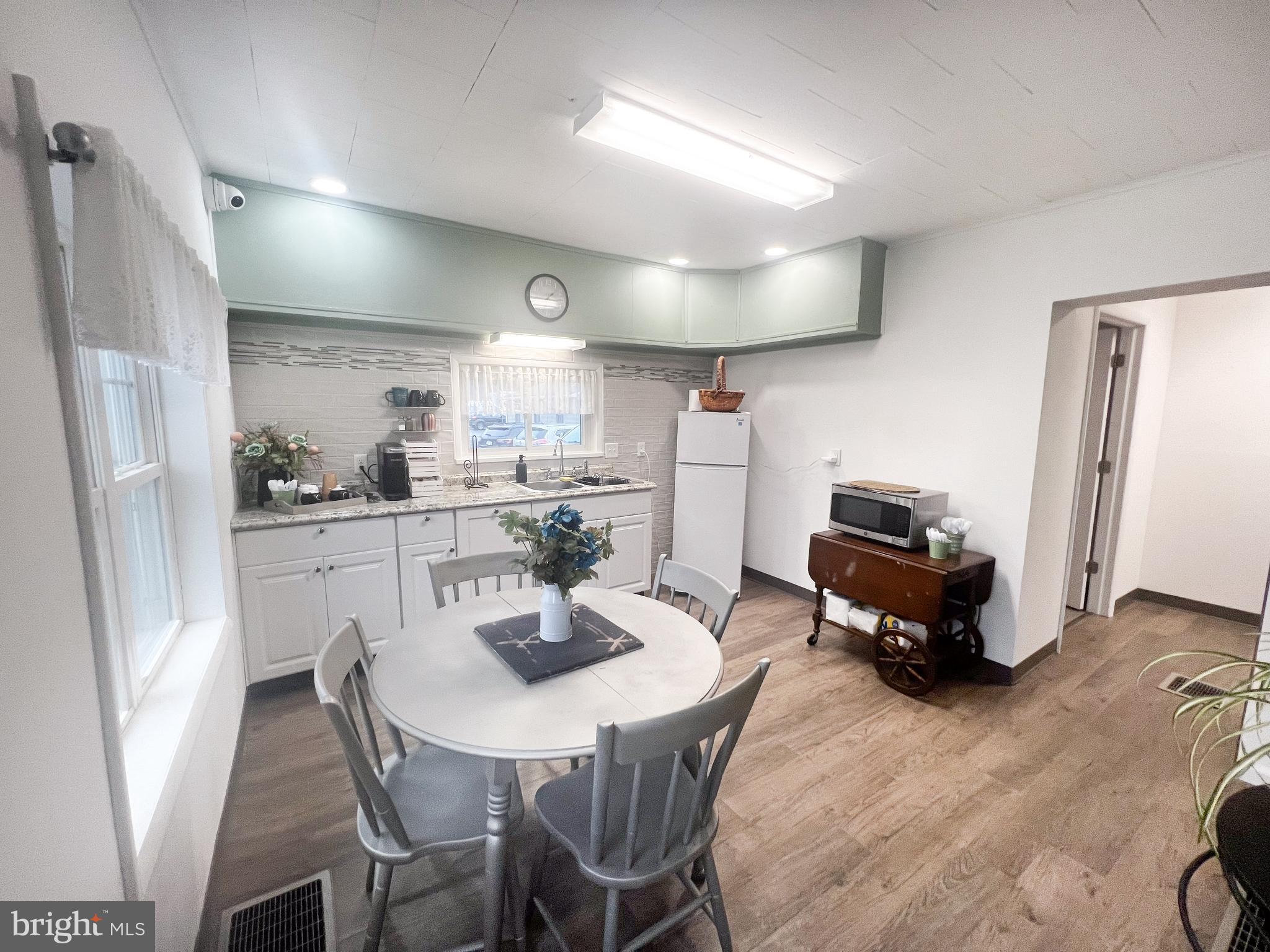 336 South Main Street Burnham, PA 17009 - Photo 14 of 36 a kitchen with stainless steel appliances a dining table chairs and refrigerator