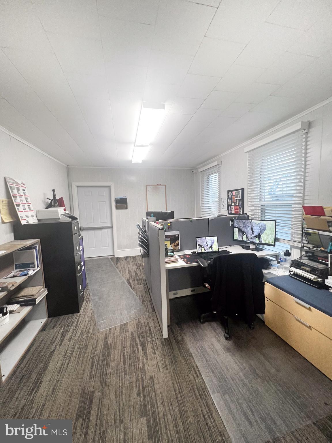336 South Main Street Burnham, PA 17009 - Photo 7 of 36 a kitchen with stainless steel appliances kitchen island granite countertop a refrigerator a stove top oven a sink dishwasher and a dining table with wooden floor