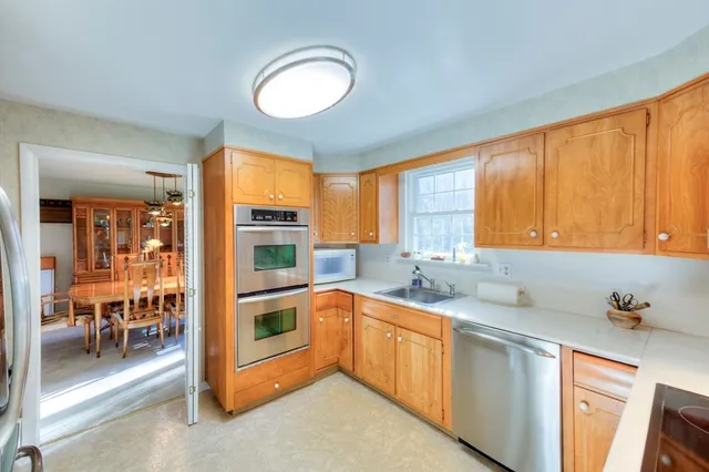 a kitchen that has a sink and cabinets