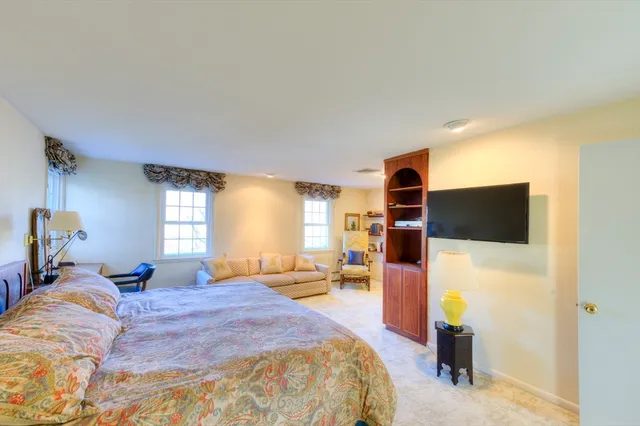 a bed room with a bed and a television