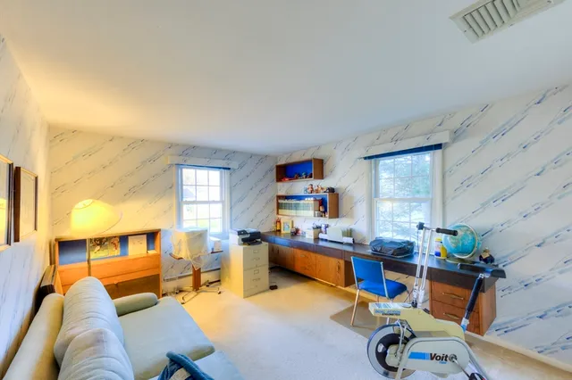 a living room with furniture and a table