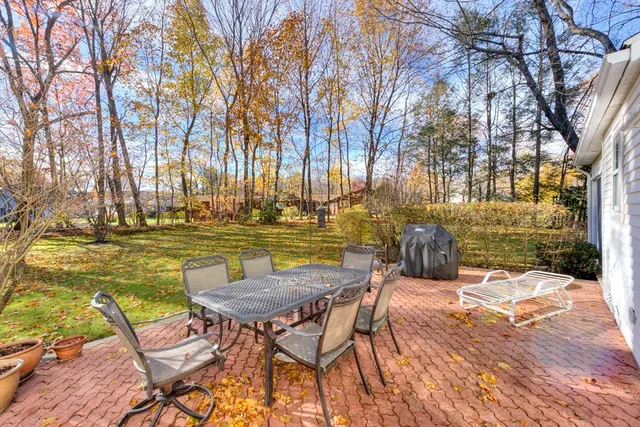 a view of a chairs and table on the wooden floor
