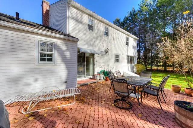 a backyard of a house with outdoor seating