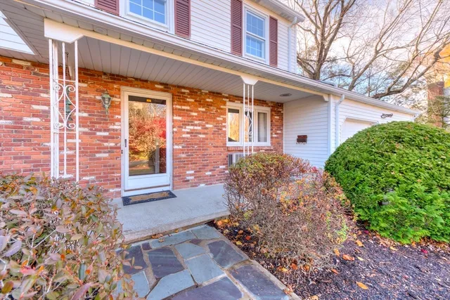a view of a house with brick walls