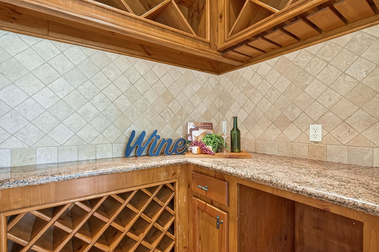 16610 Champagne Falls Court Spring, TX 77379 - Photo 30 of 50 Wine room with wrought iron gates