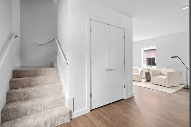 a view of an empty room and wooden floor
