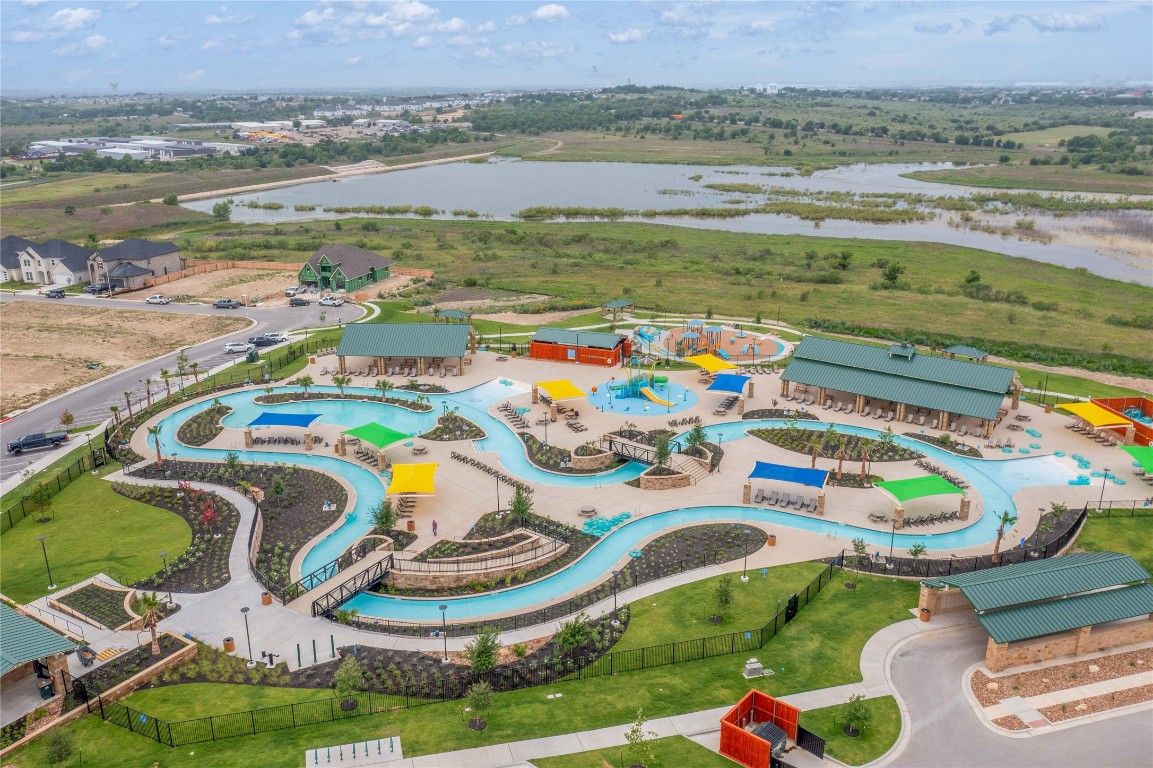 245 Begonia Street Buda, TX 78610 - Photo 16 of 21 a aerial view of a dining table and chairs with swimming pool and mountain view