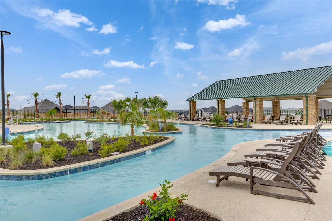 245 Begonia Street Buda, TX 78610 - Photo 19 of 21 a view of a swimming pool with outdoor seating