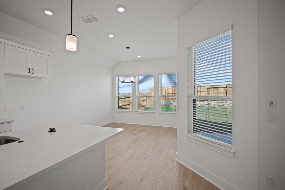 245 Begonia Street Buda, TX 78610 - Photo 6 of 21 a view of an empty room with a window