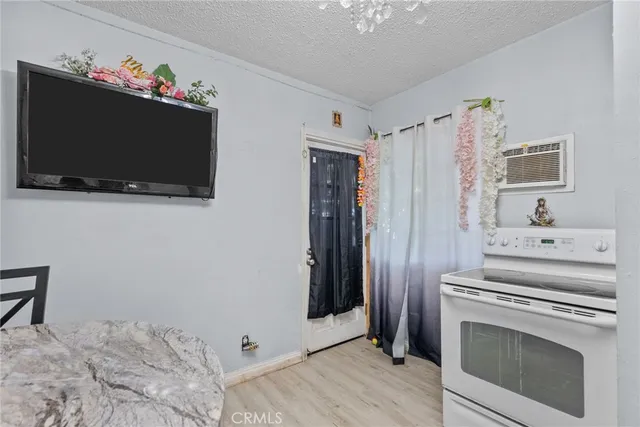 a view of a livingroom with furniture and a flat screen tv