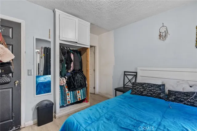 a bed room with a bed and a window