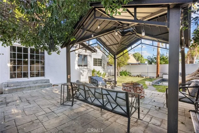 a view of a chairs and table in the patio