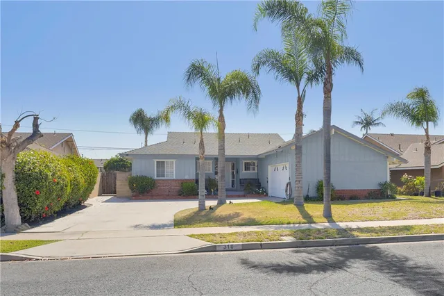 a front view of a house with swimming pool and porch