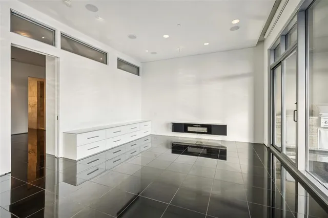 a view of an empty room with glass door