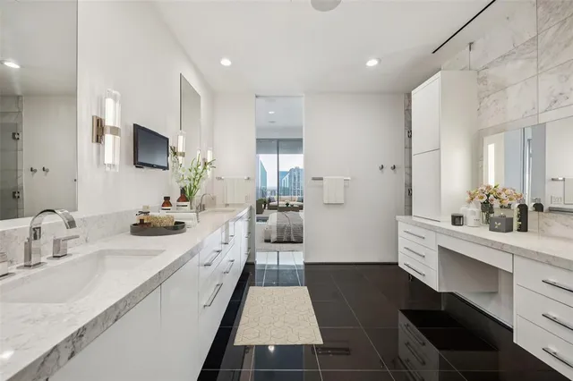 a large white kitchen with a large window