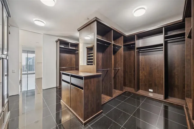 a kitchen with stainless steel appliances a refrigerator and cabinets