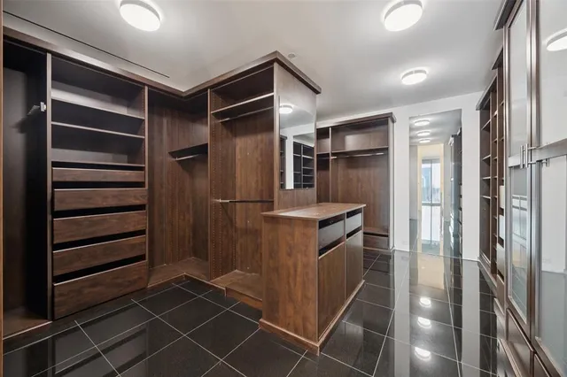 a kitchen with refrigerator cabinets and stainless steel appliances