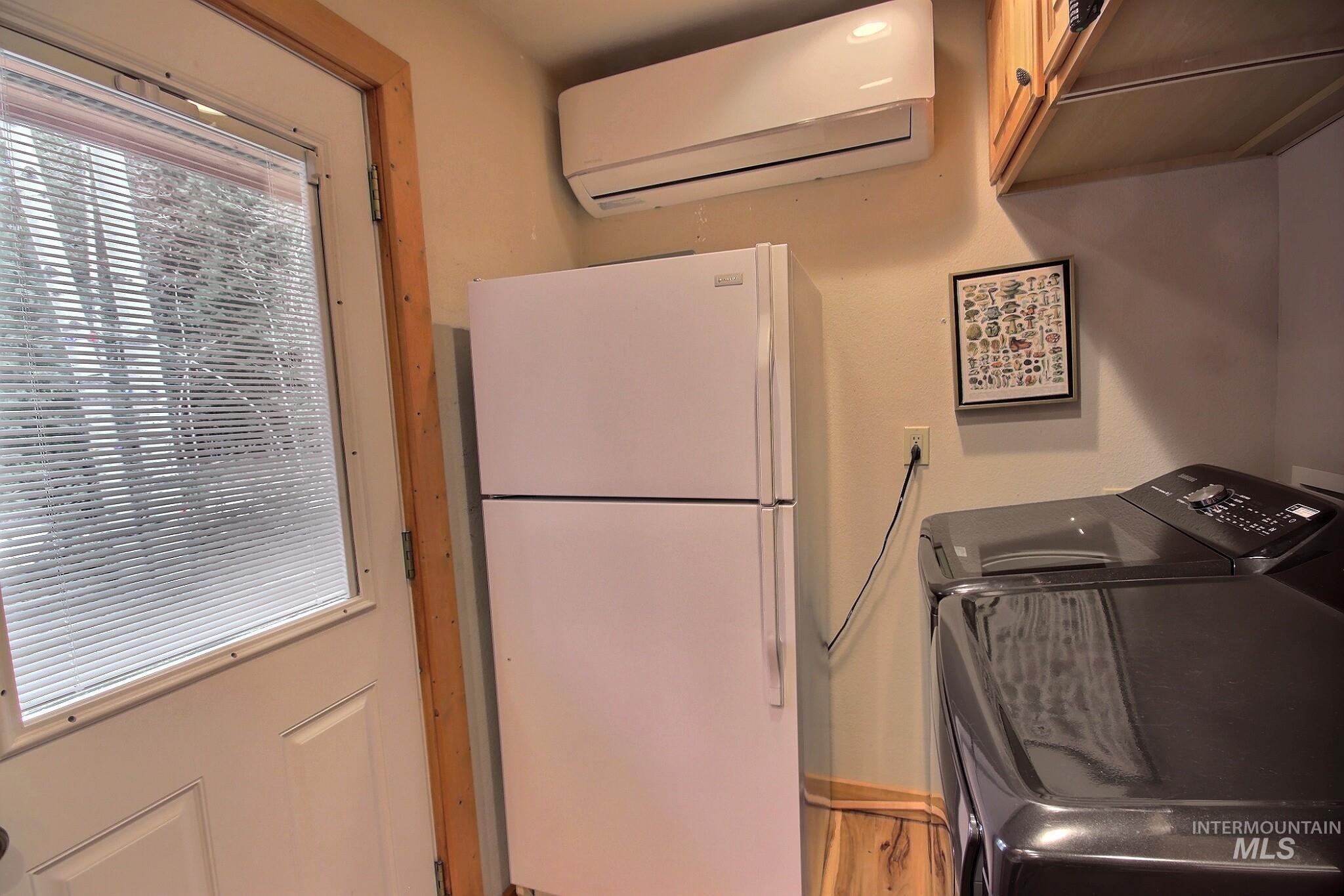 1000 Gamble Road McCall, ID 83638 - Photo 14 of 15 Washroom featuring a wall unit AC and washer and dryer