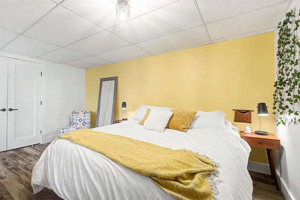 a bedroom with a bed and a desk
