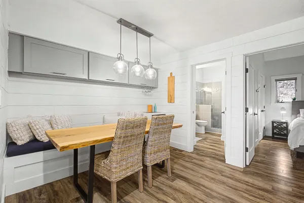 a view of a dining room with furniture and wooden floor