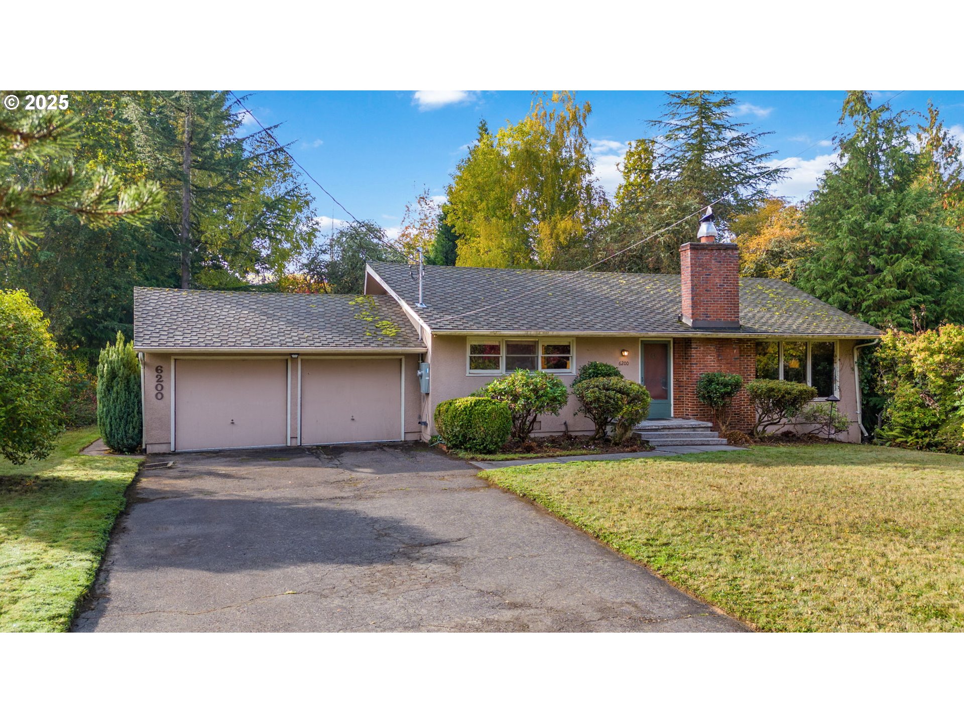 a house view with a garden space