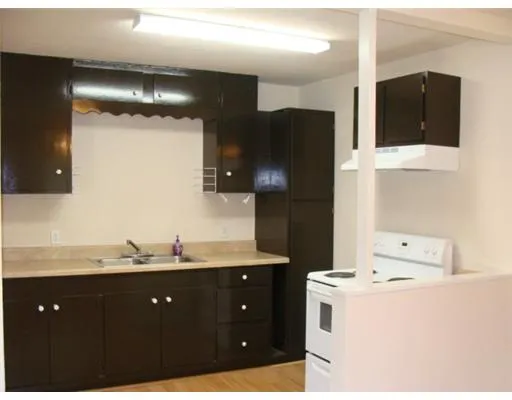 a bathroom with a double vanity sink and mirror