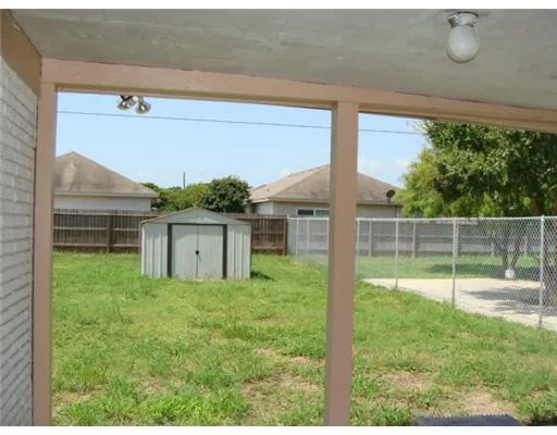 a house view with a backyard space