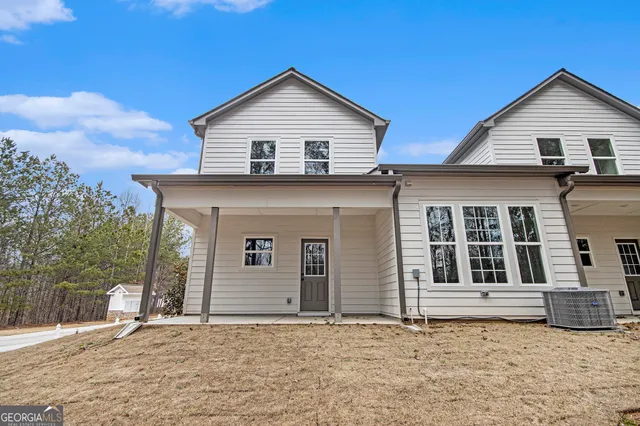 a front view of a house with garage