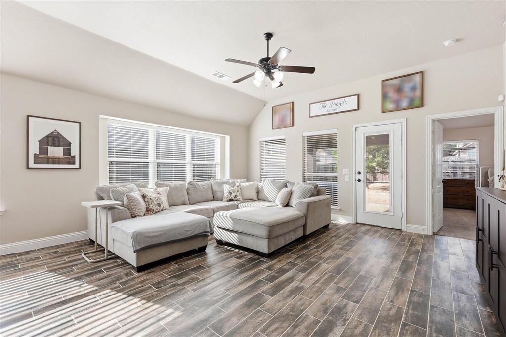 324 Sherbrook Street Van Alstyne, TX 75495 - Photo 13 of 27 a living room with furniture and a large window