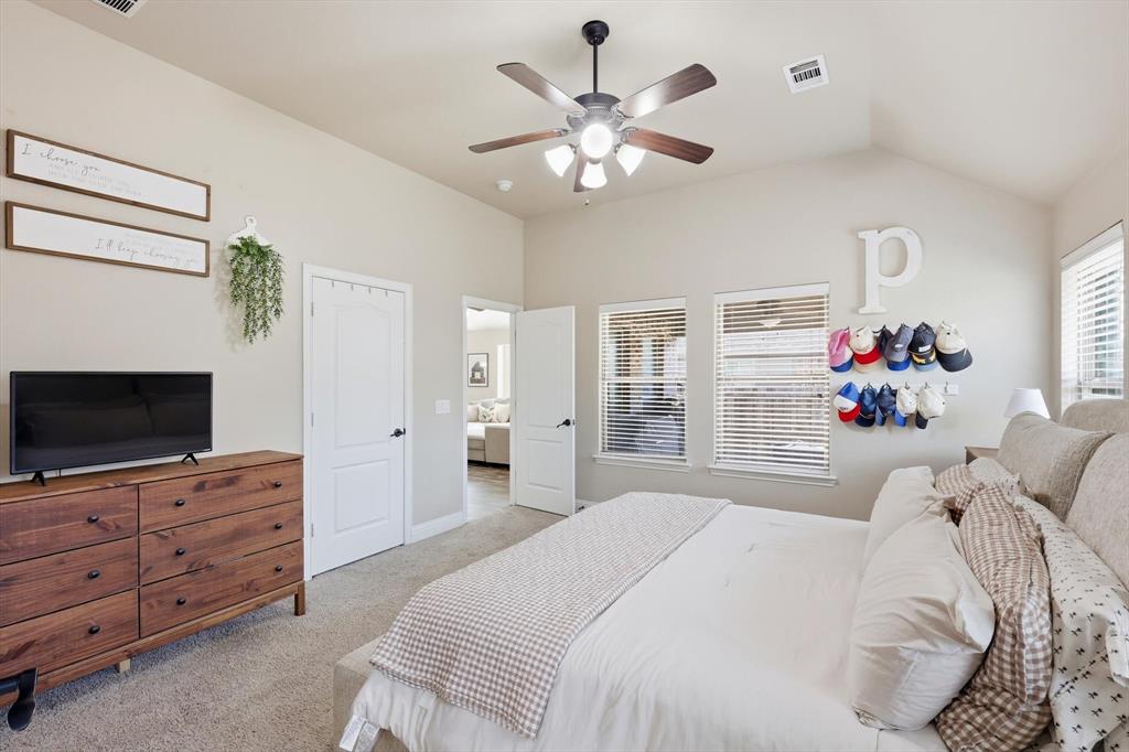 324 Sherbrook Street Van Alstyne, TX 75495 - Photo 15 of 27 a bedroom with a bed and a flat screen tv