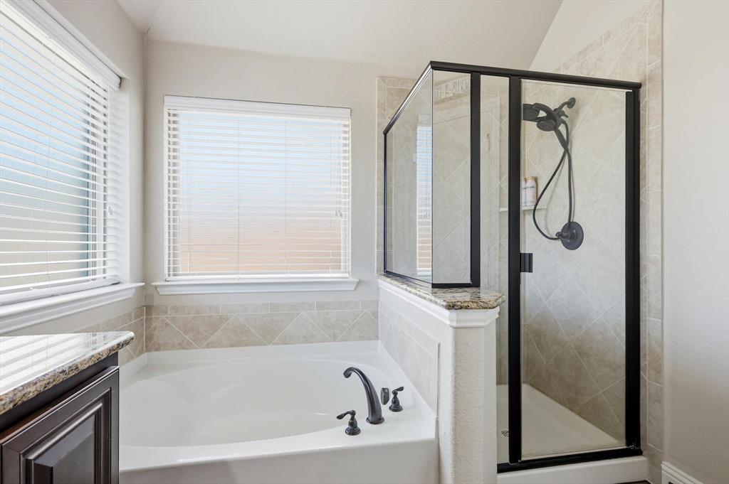 324 Sherbrook Street Van Alstyne, TX 75495 - Photo 18 of 27 a bathroom with a bathtub and a shower