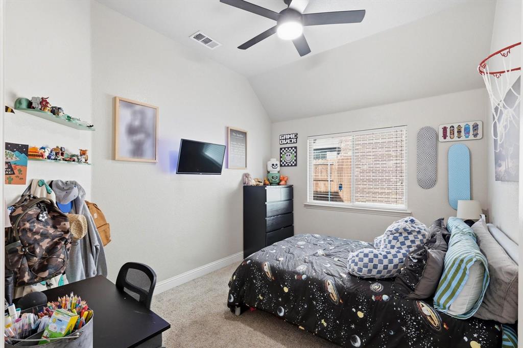 324 Sherbrook Street Van Alstyne, TX 75495 - Photo 20 of 27 a bedroom with a bed and a flat screen tv