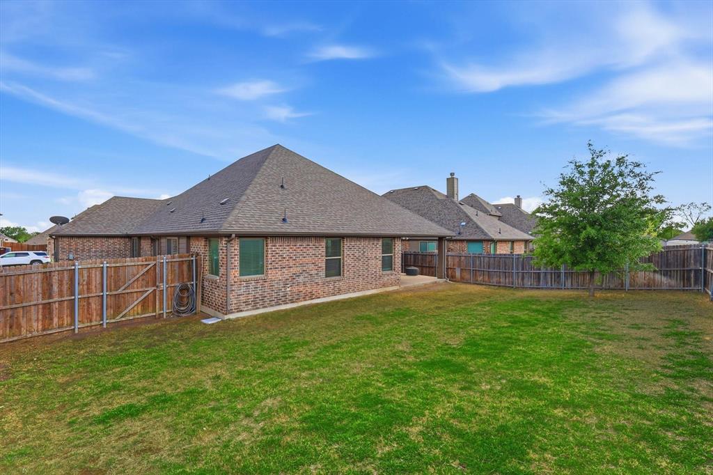 324 Sherbrook Street Van Alstyne, TX 75495 - Photo 25 of 27 a house view with a garden space