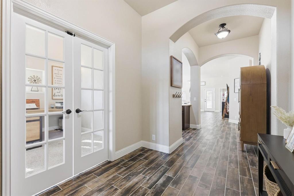 324 Sherbrook Street Van Alstyne, TX 75495 - Photo 4 of 27 a view of a hallway with wooden floor and closet