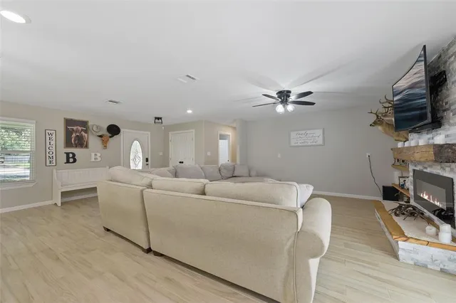 a dining room with furniture and wooden floor