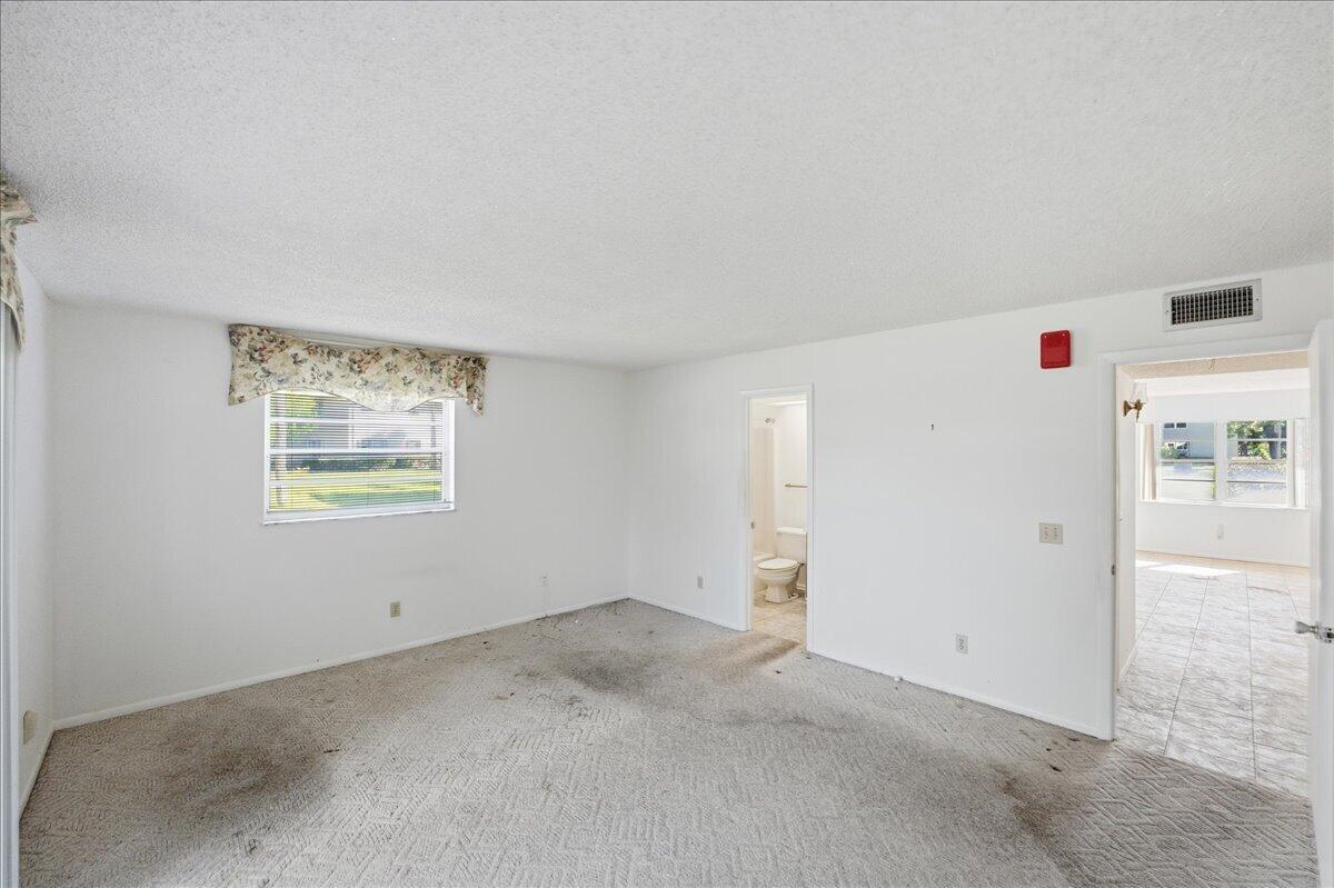 28 Lake Vista Trail, Unit 105 Port St. Lucie, FL 34952 - Photo 11 of 26 an empty room with windows