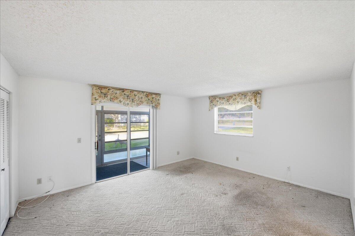 28 Lake Vista Trail, Unit 105 Port St. Lucie, FL 34952 - Photo 13 of 26 an empty room with windows