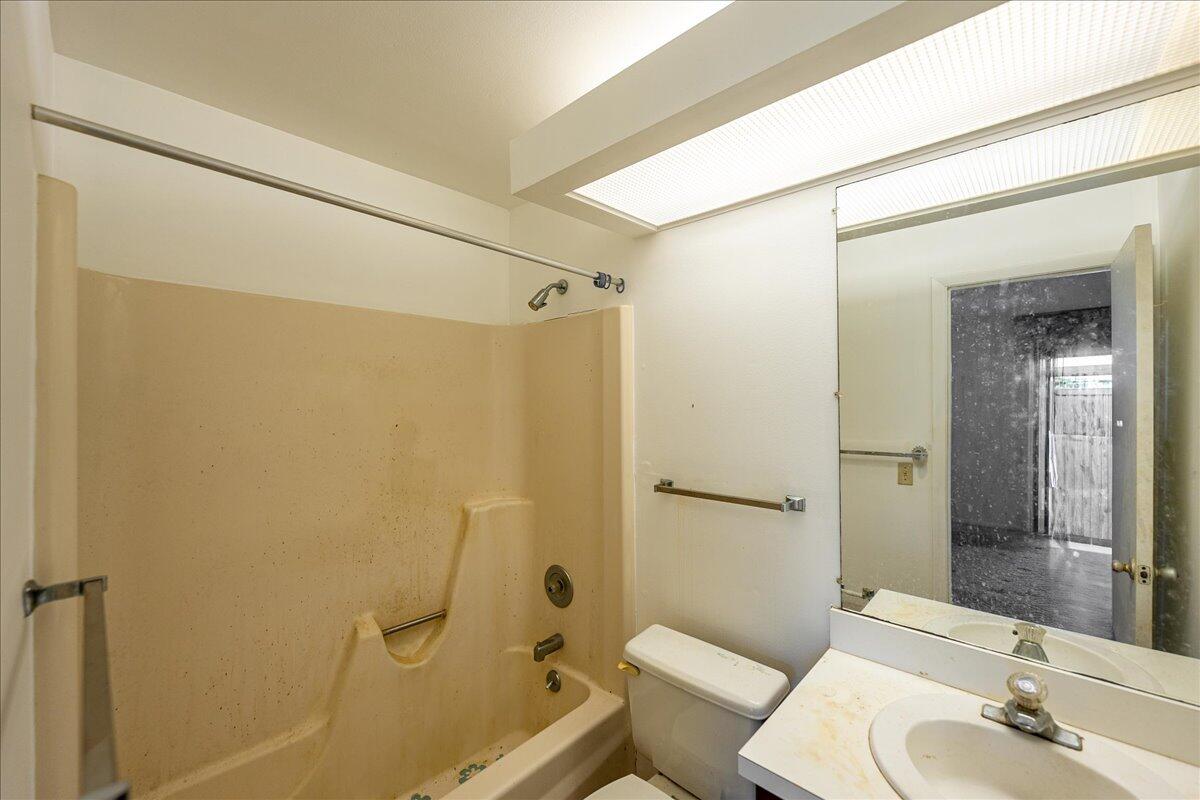 28 Lake Vista Trail, Unit 105 Port St. Lucie, FL 34952 - Photo 15 of 26 a bathroom with a sink toilet and shower