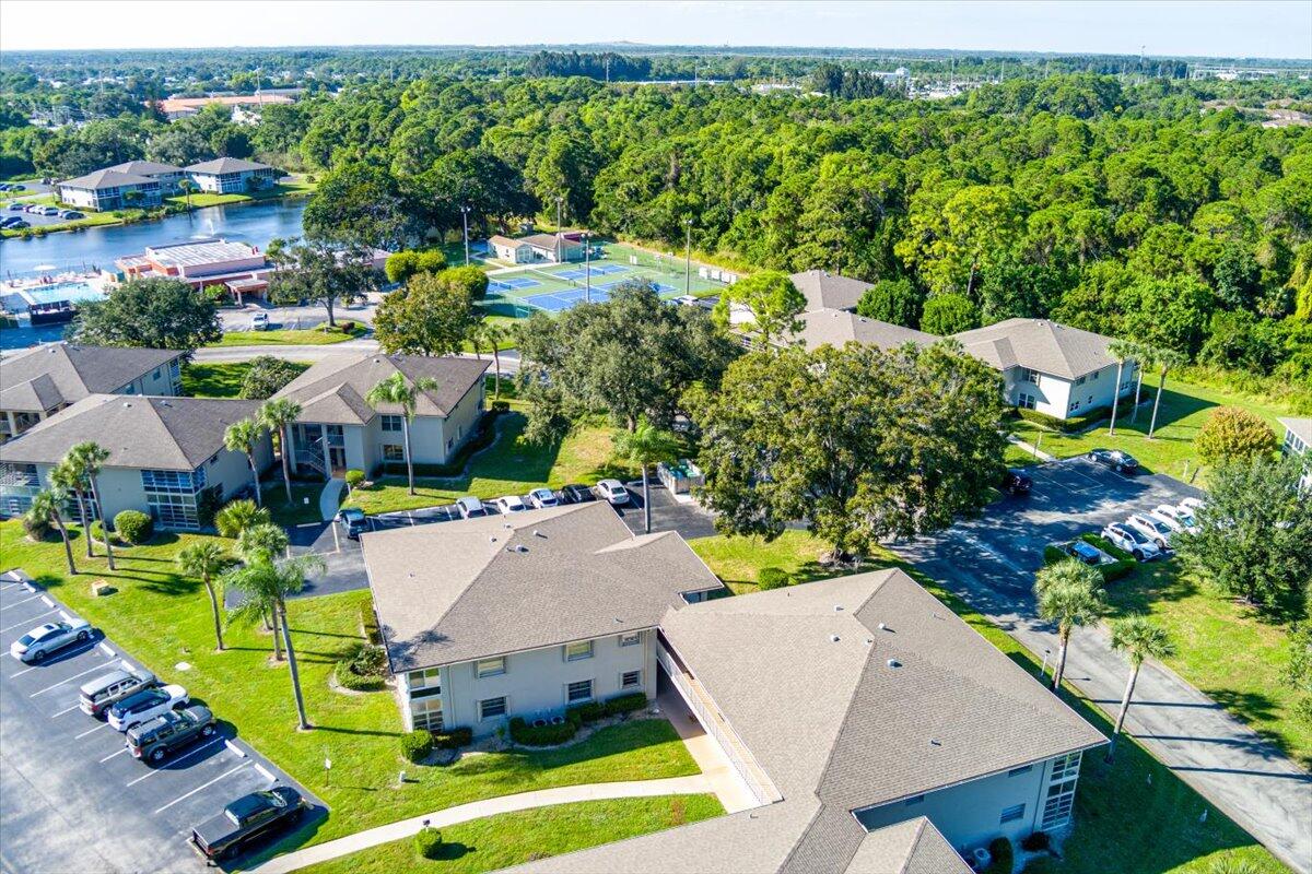 28 Lake Vista Trail, Unit 105 Port St. Lucie, FL 34952 - Photo 20 of 26 an aerial view of a house with a yard swimming pool a patio and ocean view