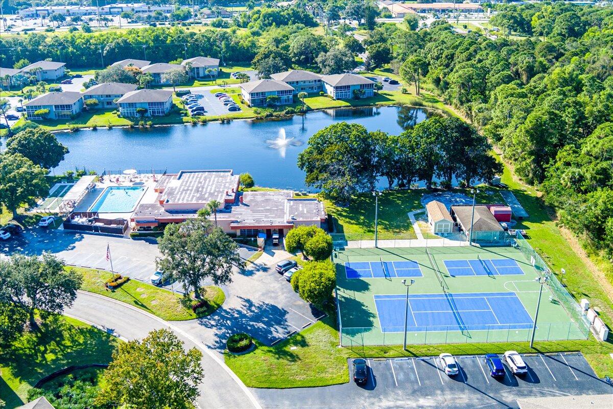28 Lake Vista Trail, Unit 105 Port St. Lucie, FL 34952 - Photo 23 of 26 a view of yard and swimming pool