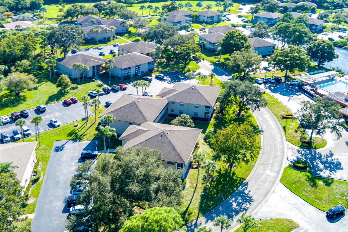 28 Lake Vista Trail, Unit 105 Port St. Lucie, FL 34952 - Photo 25 of 26 an aerial view of residential house with outdoor space and swimming pool