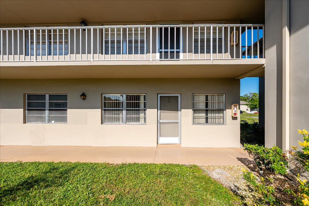 28 Lake Vista Trail, Unit 105 Port St. Lucie, FL 34952 - Photo 3 of 26 a house view with a garden space