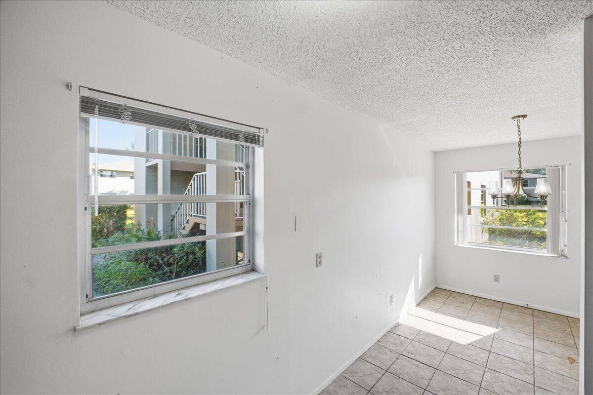 28 Lake Vista Trail, Unit 105 Port St. Lucie, FL 34952 - Photo 8 of 26 a view of an empty room with a window