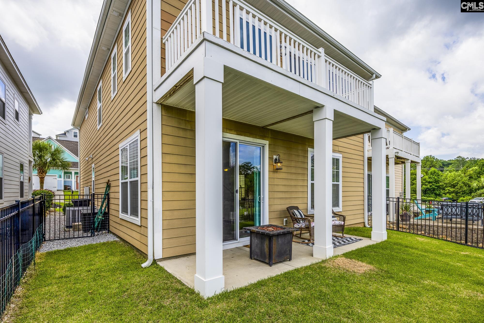 213 Sunset Point Drive Lexington, SC 29072 - Photo 31 of 35 a view of an house with backyard porch and furniture
